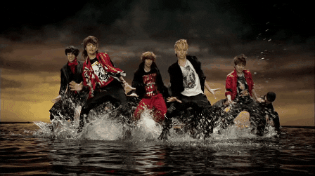 Screenshot from Ring Ding Dong Music Video of SHINee dancing in uniaon inwater